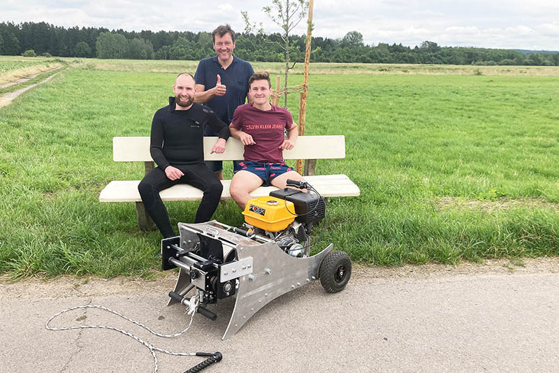 Martin Bürkle, Timo Libal und Professor Mark Nutzmann mit Wakeboard Winch